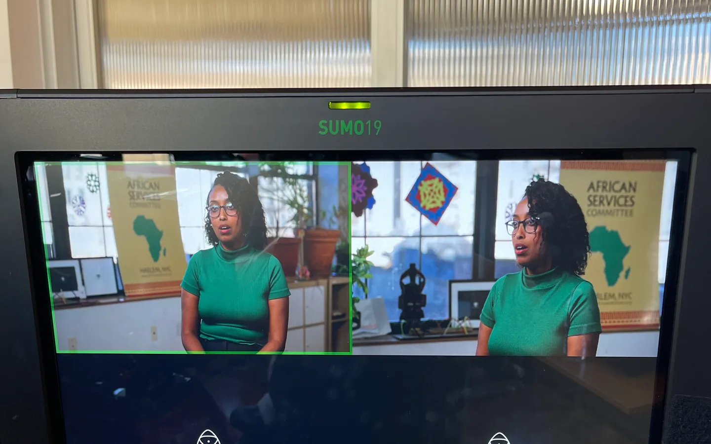 A field monitor showing a wide and a tight angle of the same interview
